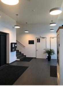 Vstupní hala nebo recepce v ubytování Myroom Business Apartment Nähe Messe München