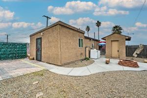 a brown building with a door and a fence at North Las Vegas Studio about 10 Mi to Strip in Las Vegas