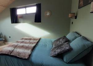 Posteľ alebo postele v izbe v ubytovaní Gîte LES TERRASSES 3