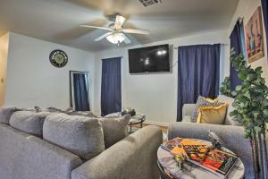 a living room with two couches and a ceiling fan at Pet-Friendly Home Less Than 3 Mi to French Quarter! in New Orleans