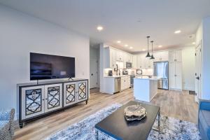 a living room with a couch and a table at Winter Escape! Downtown Traverse City Condo in Traverse City