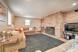 a living room with a couch and a fireplace at Memphis Vacation Rental - half Mi to Graceland in Memphis
