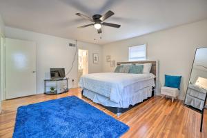 a bedroom with a bed and a ceiling fan at Memphis Vacation Rental - half Mi to Graceland in Memphis