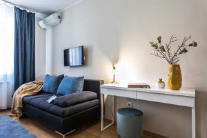 a living room with a couch and a table at Kikerics vendégház in Villány