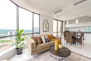 a living room with a couch and a table at Sandton Skye Serviced Apartments in Johannesburg