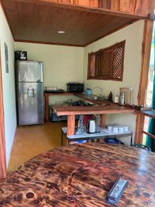a kitchen with a counter top and a refrigerator at Bahías Lodge in Rincón