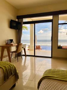 TV a/nebo společenská místnost v ubytování Vista Las Olas Resort