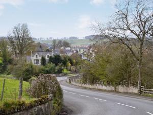 a winding road in a small town with houses at Broadstone Cottage in Norham