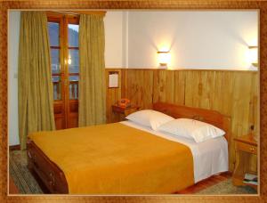 Voodi või voodid majutusasutuse HOTEL MARI Metsovo toas