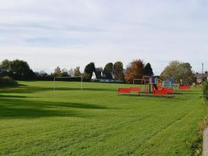 an empty field with a playground withgoalisers at Parkview in Skipton