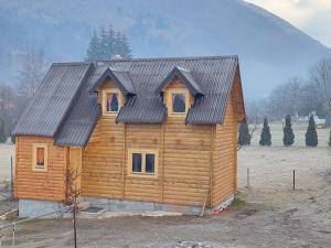 a log cabin with a metal roof at Dušan_guest_house in Kolašin