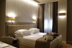Cama ou camas em um quarto em B&B Baciami Ancora