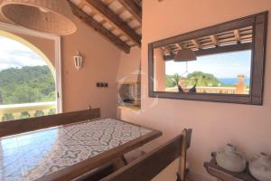 a room with a table and a large mirror at TORRE DON BENITO - Large home, sea views & pool in Begur