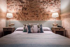 Posteľ alebo postele v izbe v ubytovaní Hotel Casa Babel