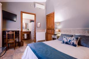 Posteľ alebo postele v izbe v ubytovaní Hotel Casa Babel
