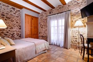 Posteľ alebo postele v izbe v ubytovaní Hotel Casa Babel