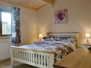 En eller flere senge i et værelse på Callow Lodge