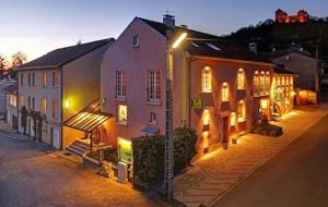 a building with a street light in front of it at Relais Manderen in Manderen