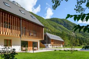a group of buildings with mountains in the background at Residence Soča in Soča