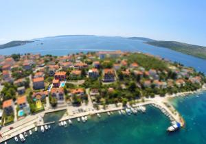 an aerial view of a small island in the water at Apartments Stina & Villa Ina in Seget Vranjica
