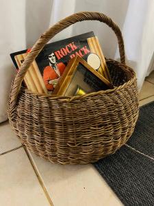 a wicker basket with books and a book at Tugela Mouth, Beach views in Tugela Mouth
