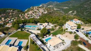an aerial view of a house with a mountain at Villa Endless Blue in Kalamitsi