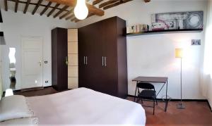 Posteľ alebo postele v izbe v ubytovaní Appartamento La Torretta