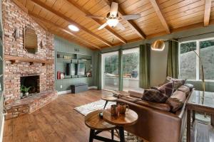 a living room with a couch and a fireplace at Designer 4 BR La Mesa Home w/ Yard and BBQ in La Mesa