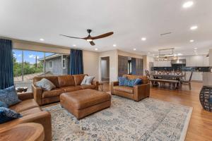 a living room with a couch and chairs and a kitchen at Designer 4 BR La Mesa Home w/ Yard and BBQ in La Mesa