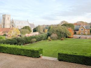 a view of a yard with a large lawn at Church Haven in Hunstanton