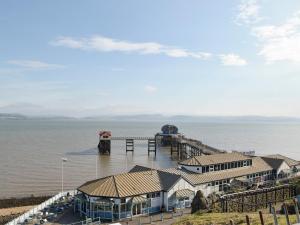 an aerial view of a pier with houses in the water at Bracelet Cottage in The Mumbles