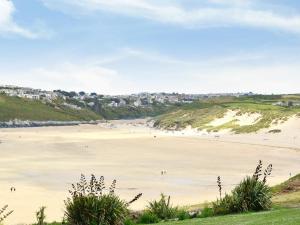 a view of a beach with people on the sand at The Old Butchers in Crantock