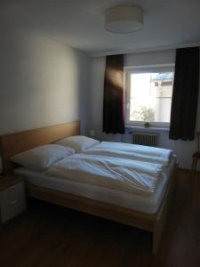 Postel nebo postele na pokoji v ubytování Appartement Schneeflöckchen