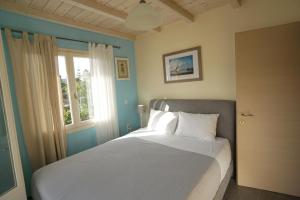 Posteľ alebo postele v izbe v ubytovaní Seaside Cottage