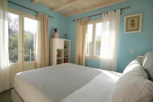 Posteľ alebo postele v izbe v ubytovaní Seaside Cottage