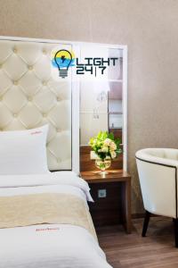 Postel nebo postele na pokoji v ubytování BonApart Hotel by UHM