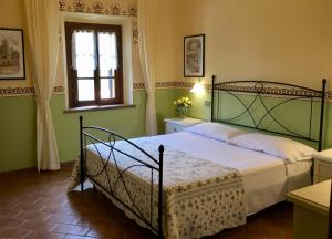 Postel nebo postele na pokoji v ubytování agriturismo macchia al pino