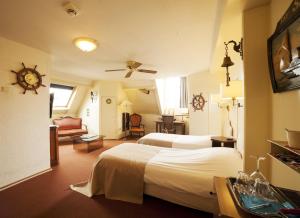 Кровать или кровати в номере Hotel Dordrecht