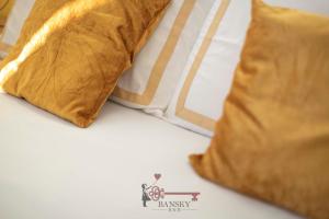a bed with two pillows on top of it at Sunny Suite Nordic - Lugano City -By EasyLife Swiss in Lugano