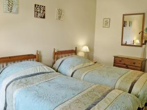 Cama ou camas em um quarto em Brunskill Cottage