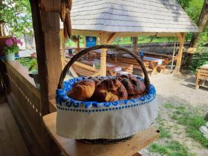 a basket of bread sitting on a table at Casa Moroșenilor - Breb in Breb