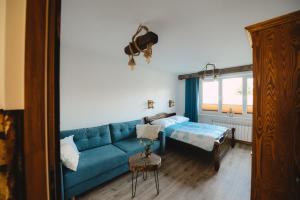 Posteľ alebo postele v izbe v ubytovaní Apartament Zielony Ruczaj w Cisnej