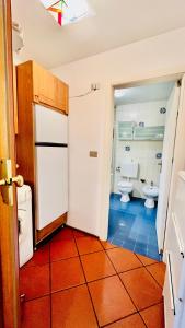 Koupelna v ubytování PredazzoHouse + 7 fotografií