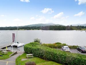 a view of a lake with cars parked at a dock at Mere View in Ambleside