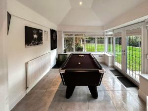 a large room with a pool table in it at Castlebar in Little Singleton