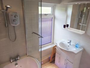 a bathroom with a shower and a sink at 3 Eldin Hall Properties in Cayton