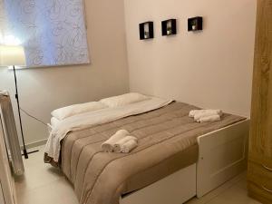 Posteľ alebo postele v izbe v ubytovaní Cozy apartment near Palermo Cathedral