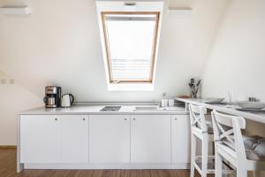 Kuchyňa alebo kuchynka v ubytovaní Krupówki Loft