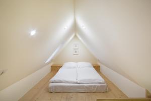 Posteľ alebo postele v izbe v ubytovaní Krupówki Loft