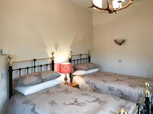 Posteľ alebo postele v izbe v ubytovaní Turin Nurin Cottage